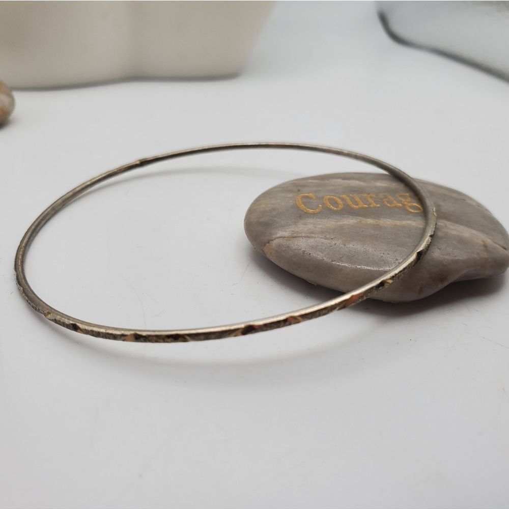 Silver tone loop bracelet bangle